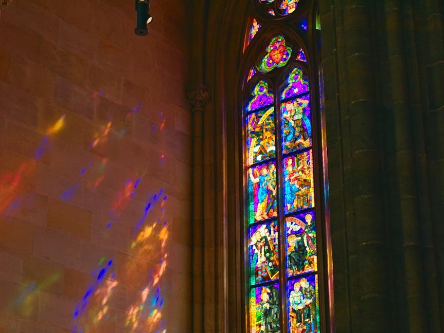 A collage of historical coats of arms and vibrant national flags.